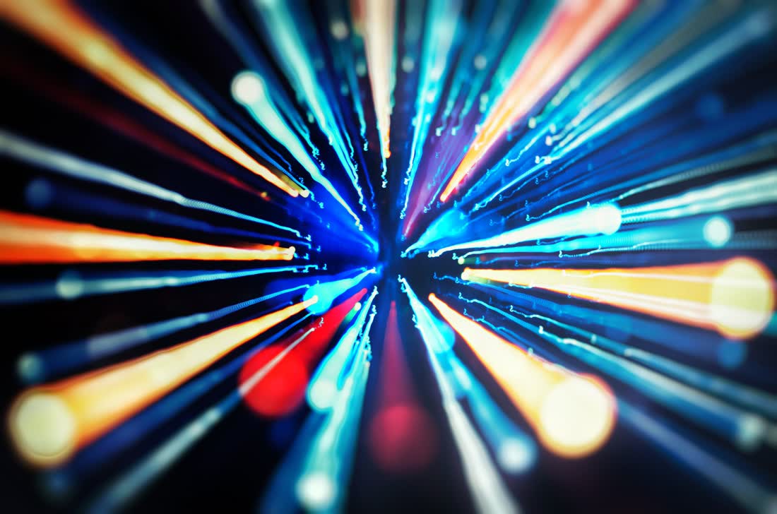 Streaks of coloured light converging toward a single point